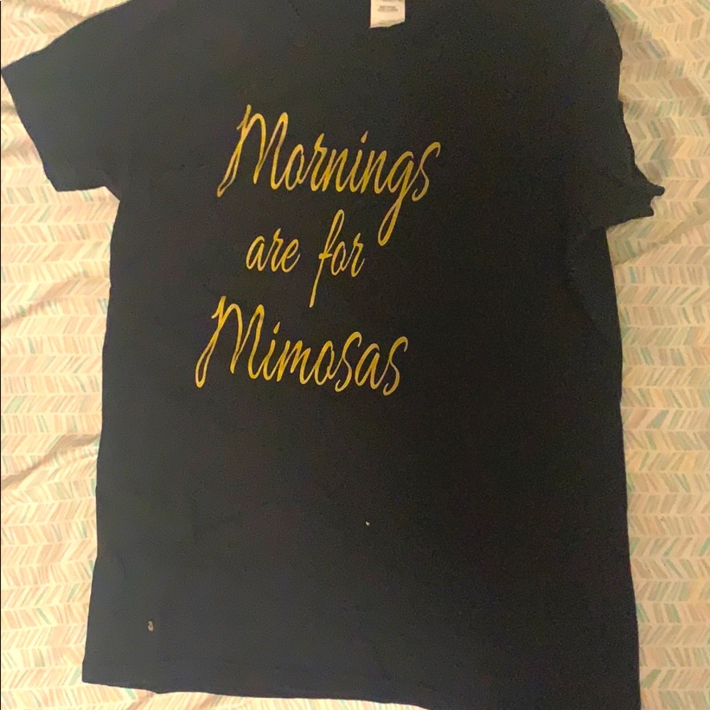 It’s a black shirt with gold words